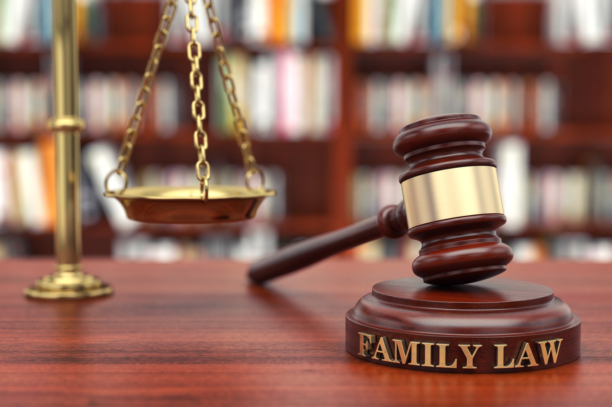 Gavel and scales on family law table.