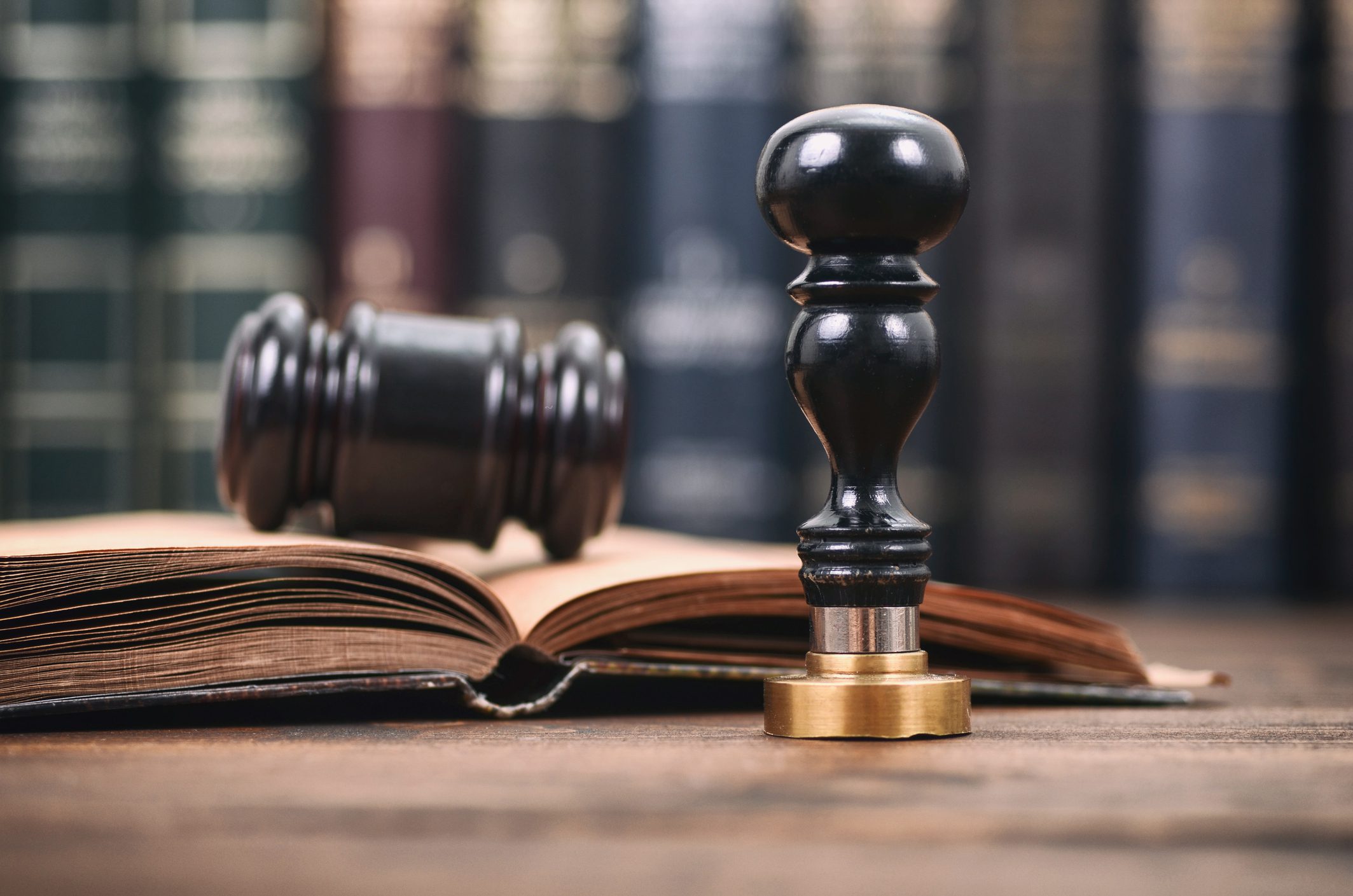 Gavel and seal on open book.